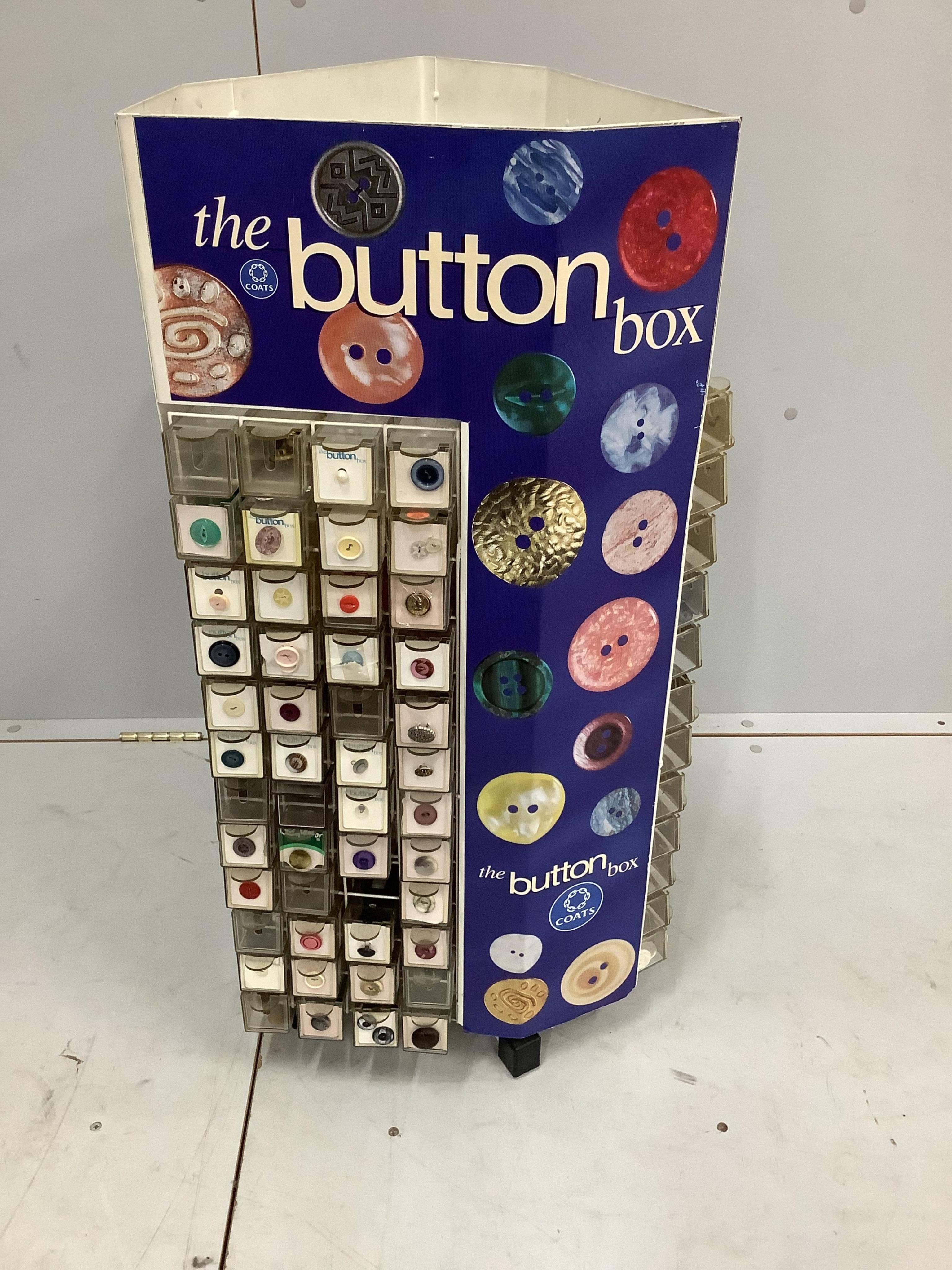 A Coats 'button box’ haberdasher's button display carousel, with a quantity of assorted buttons, width 39cm, height 86cm. Condition - fair